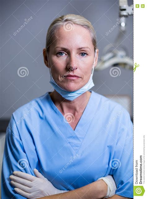 dental assistant standing  arm crossed  clinic stock image image  hygienist gloves