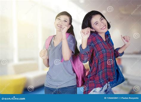 excited college students dancing   library stock image image  classmate bookcase
