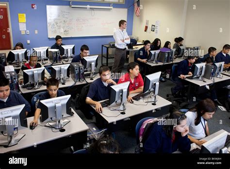 teacher monitors high school students  computer lab  charter school peak preparatory academy