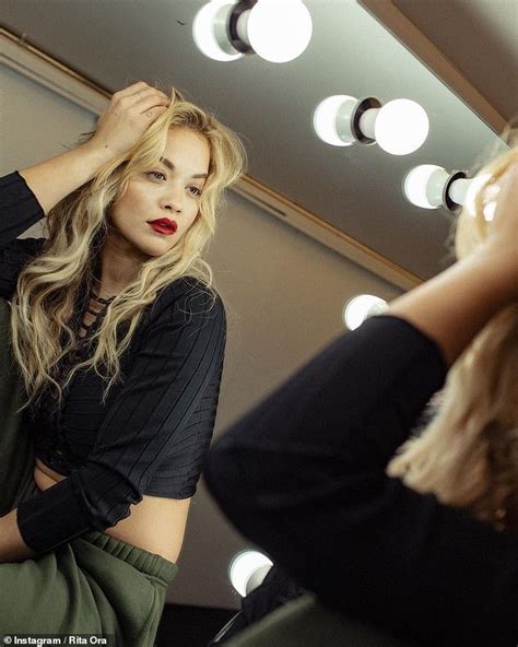 rita ora wears deep red lipstick for edgy mirror photo shoot daily