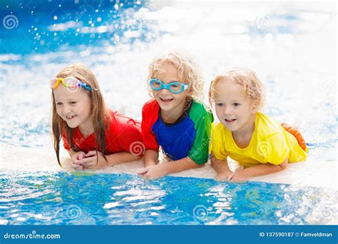 kids  swimming pool children swim family fun royalty  stock