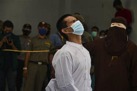 2 men publicly caned for having sex by religious police in indonesia
