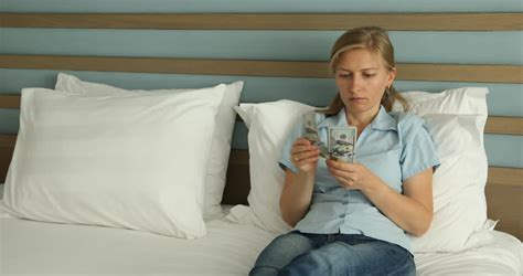 disappointed sad man sitting on bed can t have sex with his wife that is waiting to make love