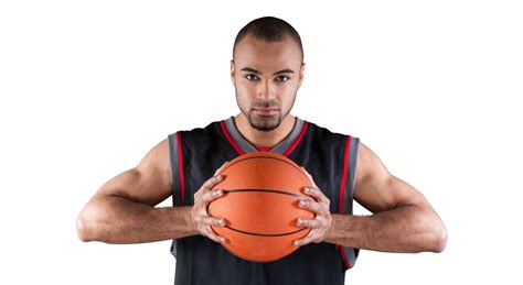 basketball player holding ball   rim