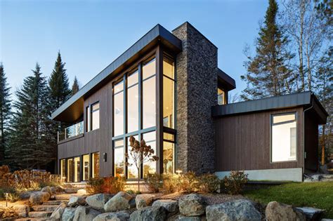 modern lake house  canada   exterior clad  wood stone  metal contemporist