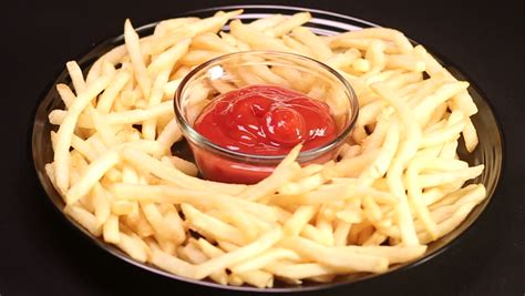 french fries dipped in ketchup stock footage video 3602918 shutterstock