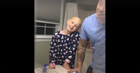 loving dad shaves head for daughter without hair