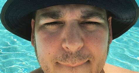rob kardashian poses shirtless by the pool as he shows off stunning