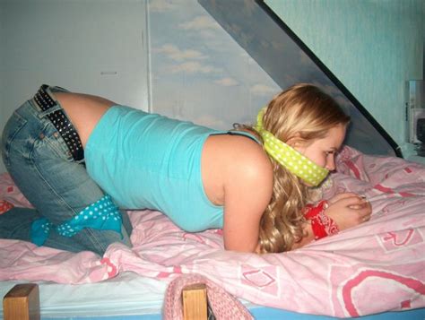 blond tied up in bed fully clothed a beautiful sight