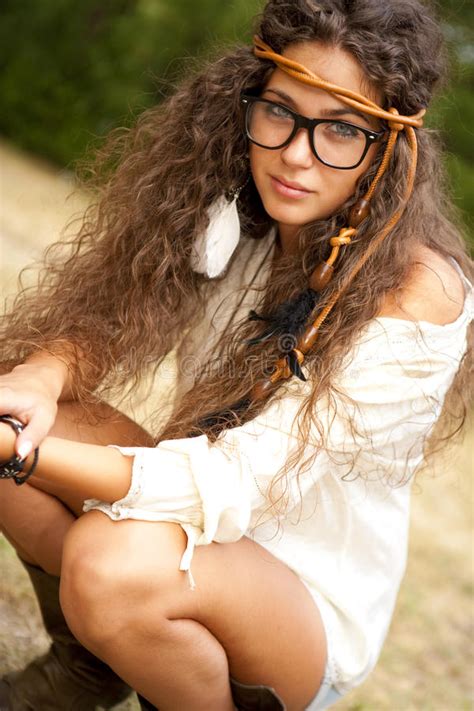 beautiful hippie girl with glasses in the park stock image