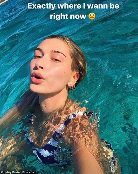 hailey baldwin shows off tan lines and sunkissed physique