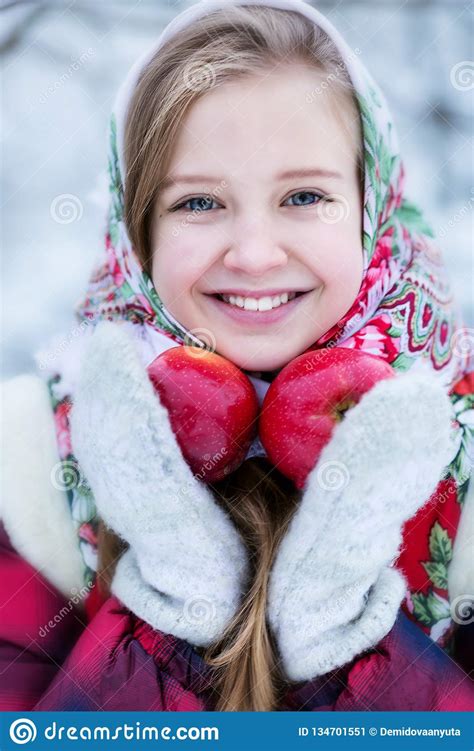 beautiful teen girl in russian national clothes with red