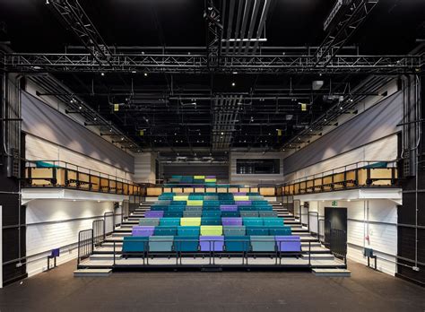 jestico whiles iridescent tile clad theater space
