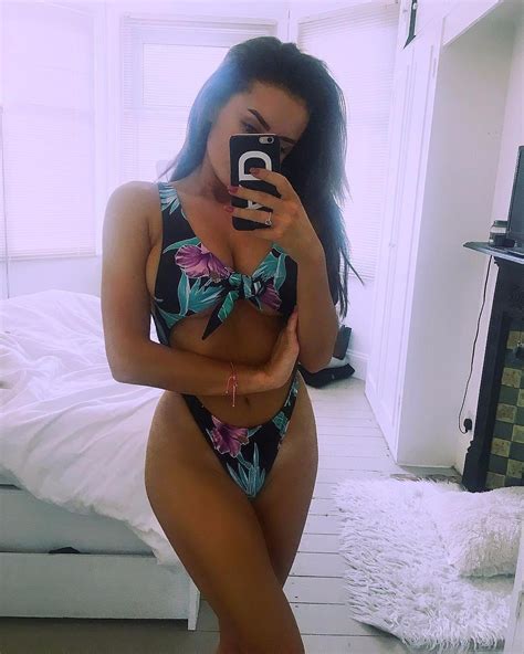 love island s amber davies shows off her cleavage in floral bikini as she posts sexy selfie on