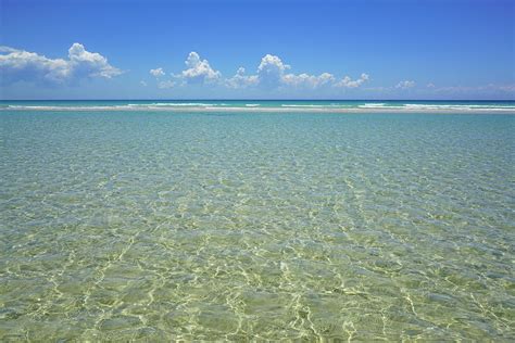 Where Crystal Clear Ocean Waters Meet The Sky Photograph