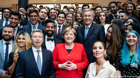 merkel marks german constitution anniversary by
