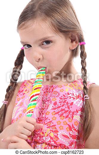 Girl Sucking On A Candy Stick Canstock
