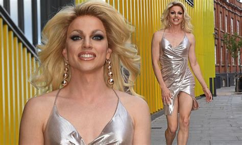 courtney act struggles to contain her curves in mini dress daily mail online