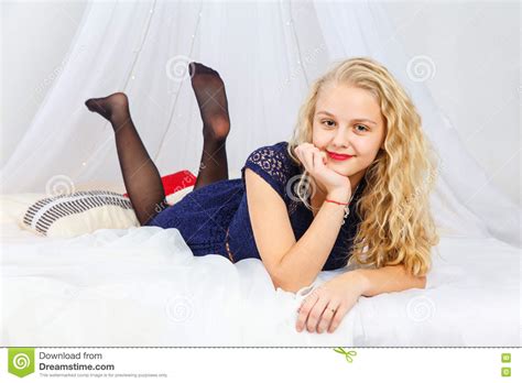 Girl Lying On The Bed Royalty Free Stock Image