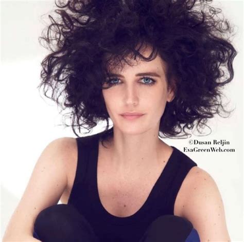 A Woman With Curly Hair And Blue Eyes Posing For A Magazine Cover Photo
