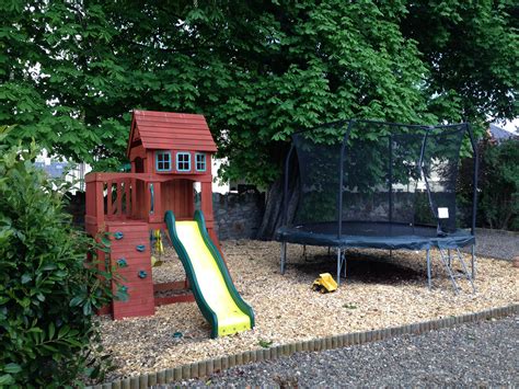 spacious childrens play area  soft bark chip flooring  jumps