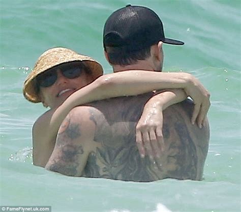 cameron diaz and benji madden frolic in the florida surf