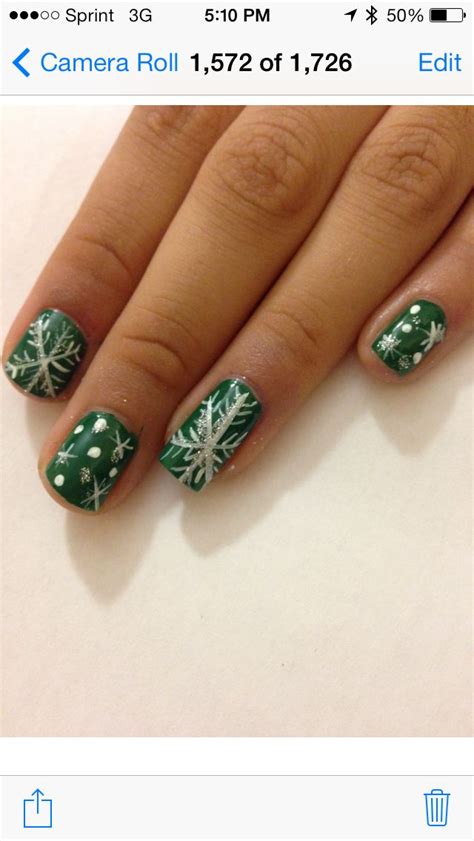 snowflakes on green nails a nice twist to add some color