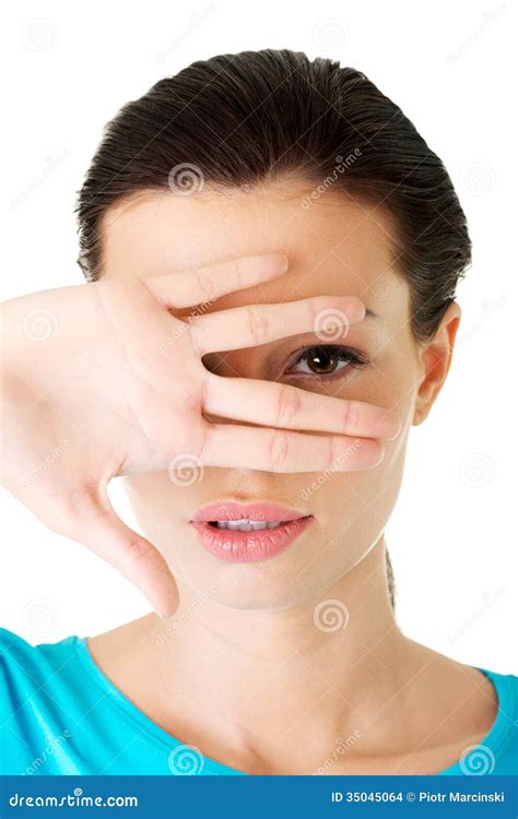 attractive woman covering  face  hand stock photo image  expression fingers
