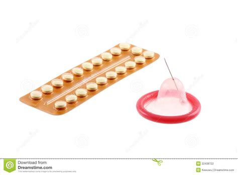 birth control pills and a condom with a pinhole stock