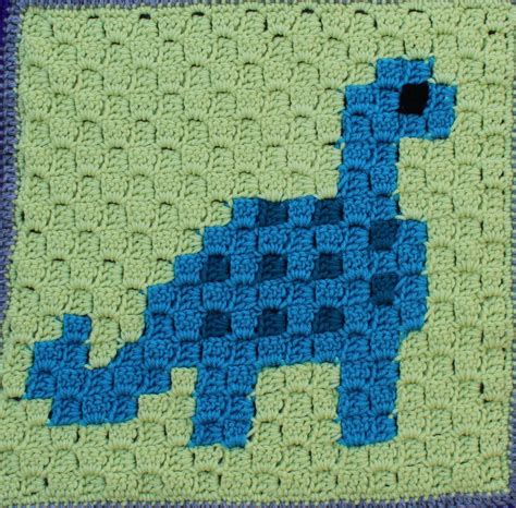 blue  green crocheted blanket   image   dinosaur