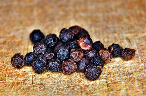 royalty free photo black pepper on brown top surface