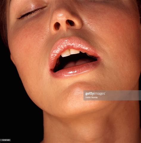 Young Woman With Mouth Open Eyes Closed Closeup Photo Getty Images