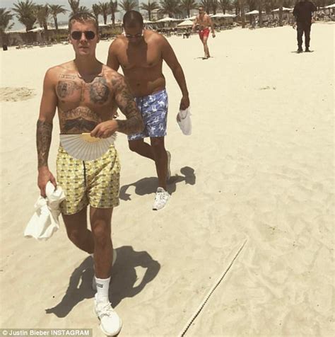 justin bieber chats away to mystery brunette in dubai