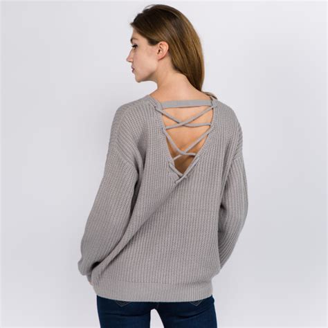 solid color knitted sweater featuring criss cross v neck back details