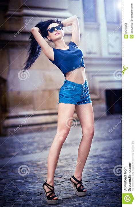 Portrait Of A Beautiful Woman With Denim Shorts And