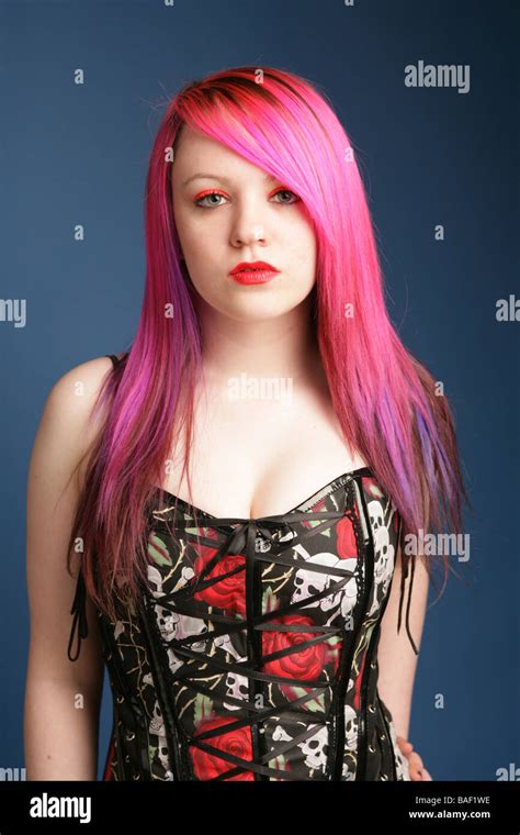 portrait of a beautiful teen girl with long pink hair pale