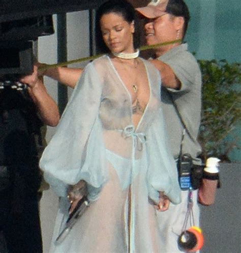 why was rihanna walking around almost naked with a gun in miami the source