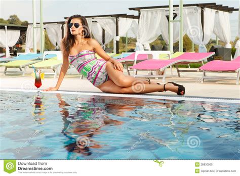 Hot Brunette With Sun Glasses On Pool Side Stock Image