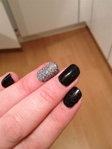 red carpet manicure black sparkly   silver glitter nail