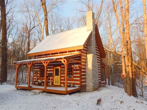 small log cabin   woods  snow   ground