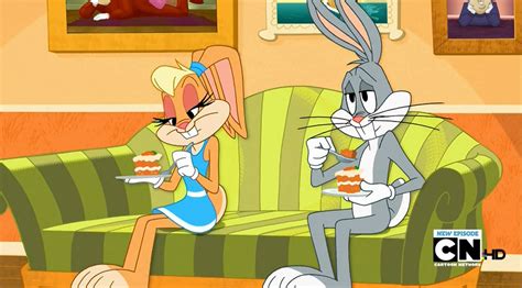 two cartoon characters sitting on a couch eating cake