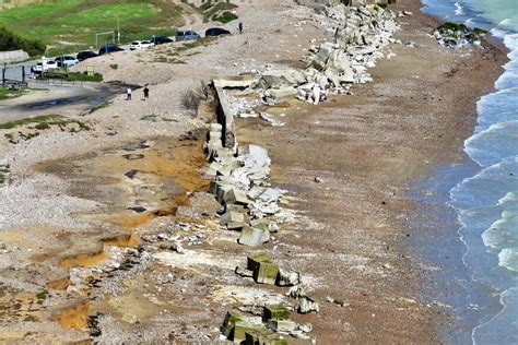 drone pictures show knackered flood defences  met office storm warning