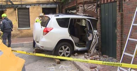 uber driver slams into building