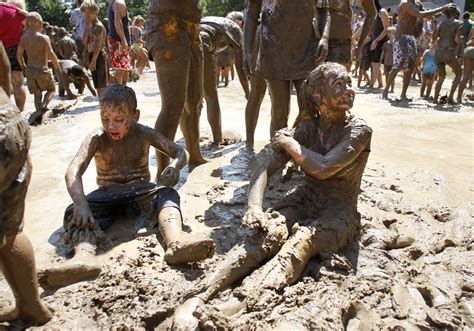 revelers celebrate annual mud day