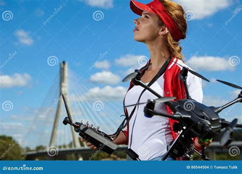 woman  standing  holding drone stock photo image  hover multi