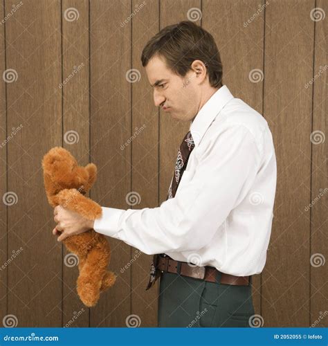 man holding  stuffed animal stock image image  stuffed person