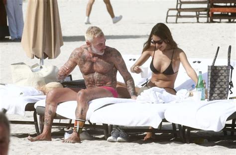 gianluca vacchi and sharon fonseca enjoy a romantic day at the beach in