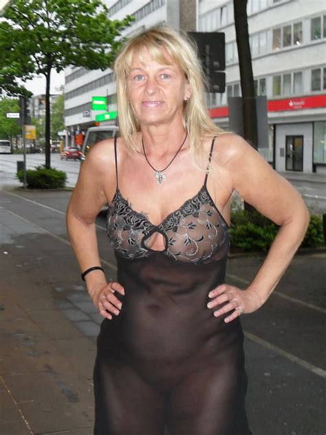 mature blonde lady in sexy nightie on the street 13429