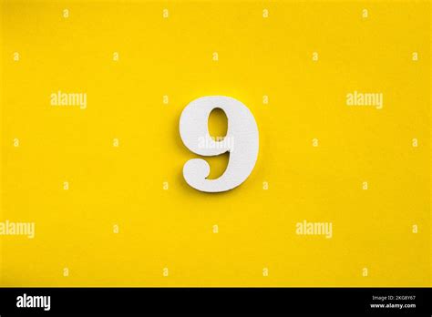 number  white wooden number  yellow background stock photo alamy