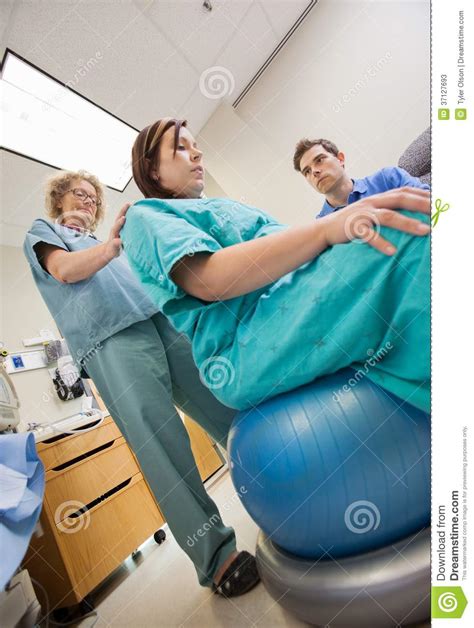 nurse assisting pregnant woman sitting on exercise stock image image 37127693